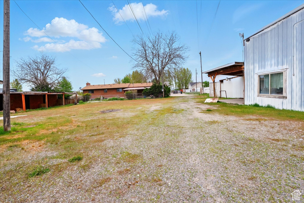 View of yard featuring fence