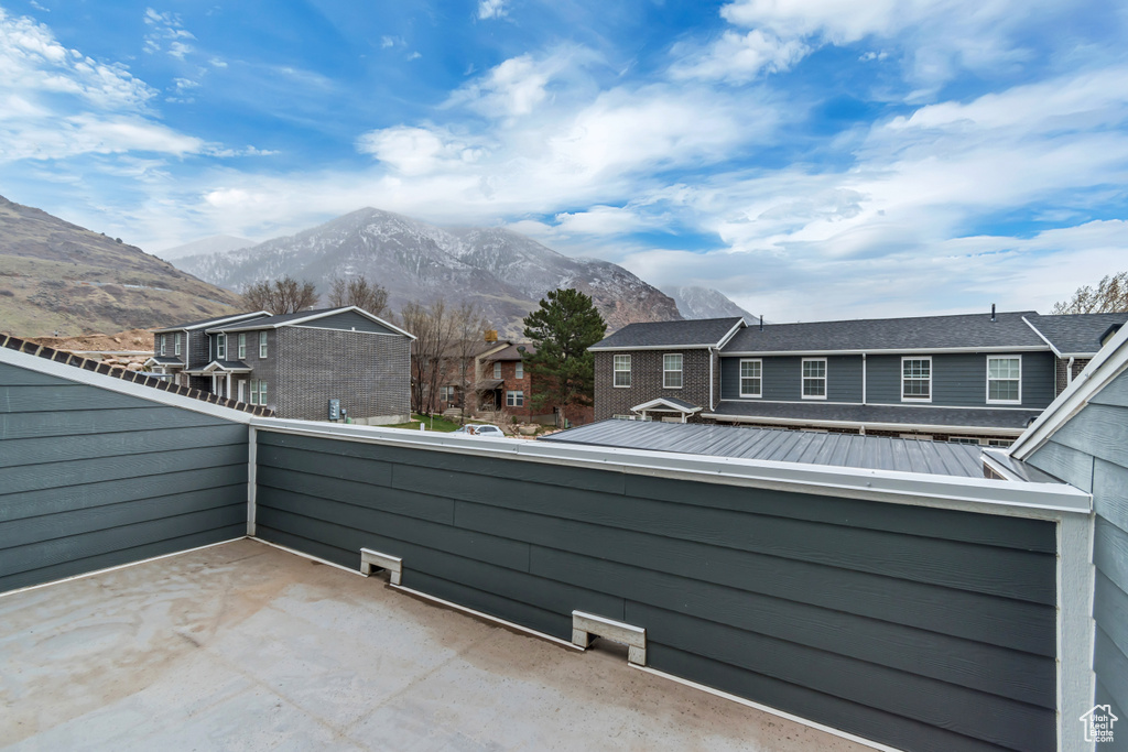Balcony featuring a mountain view and a residential view