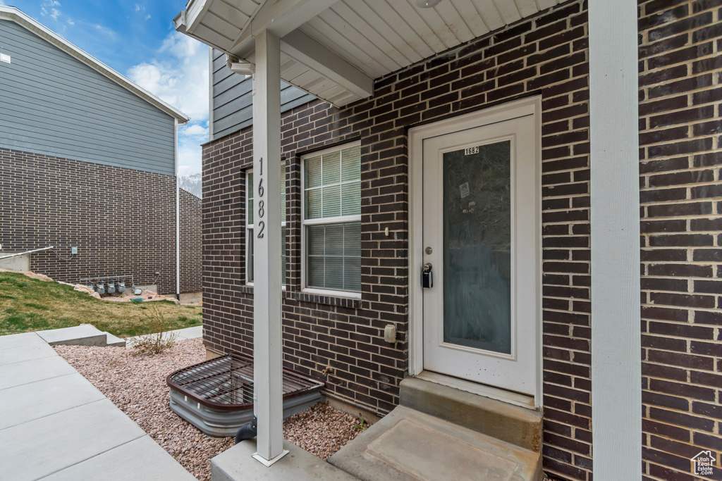 Property entrance with brick siding
