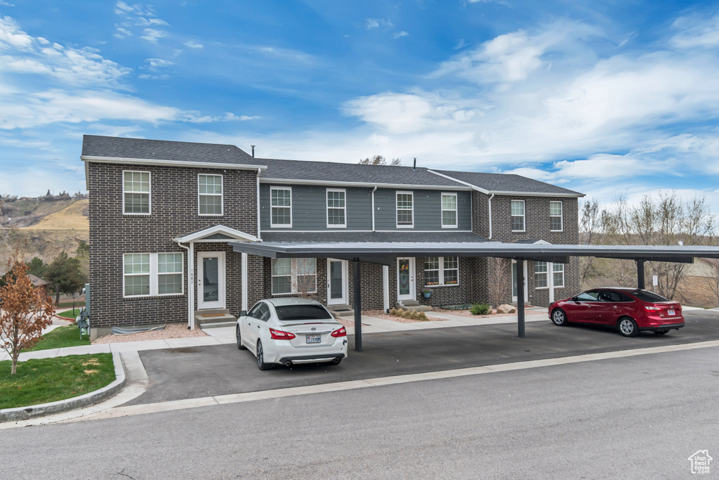 Townhome / multi-family property with brick siding