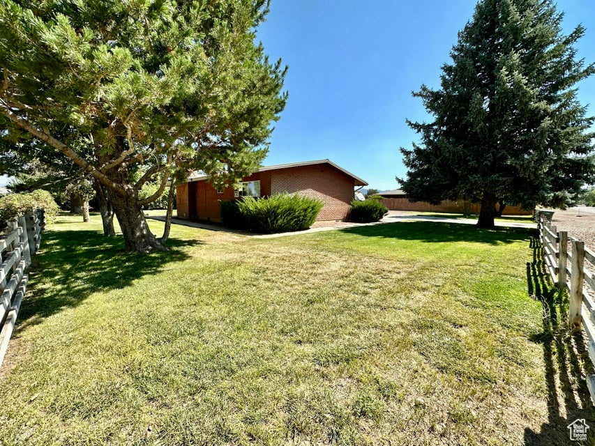 View of yard featuring fence
