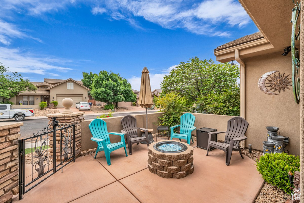 View of patio featuring an outdoor fire pit