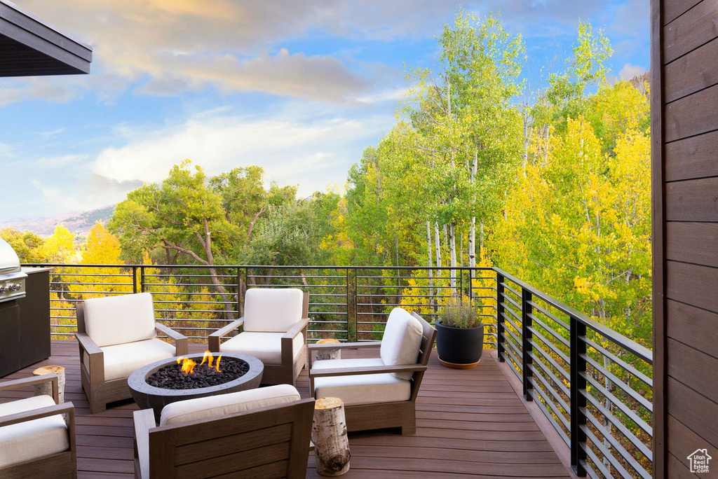 Wooden terrace with an outdoor fire pit
