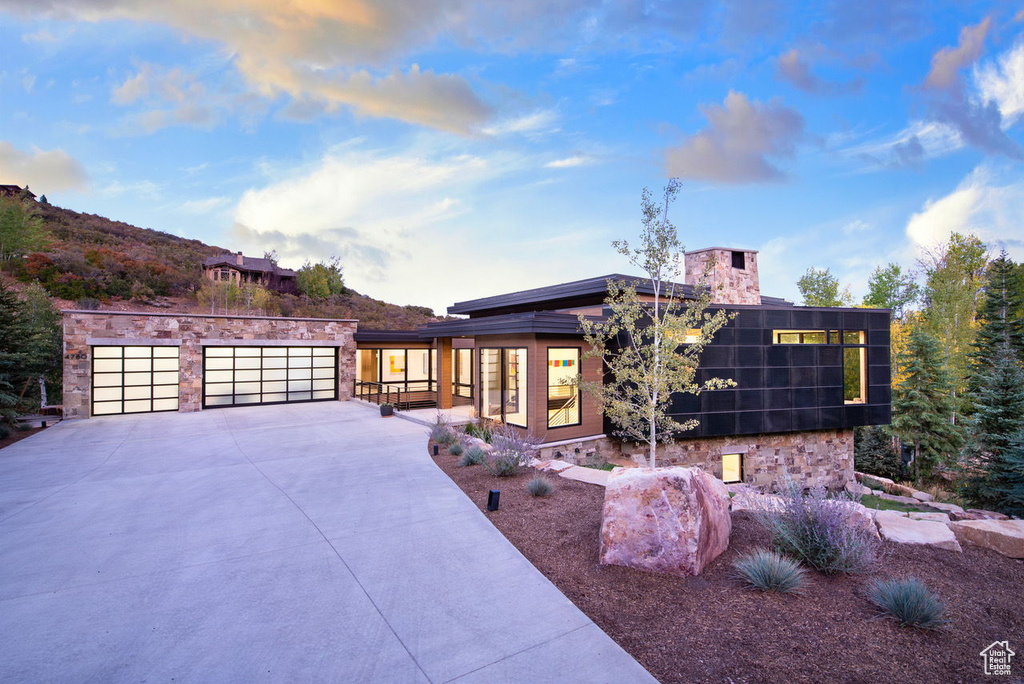 Exterior space with stone siding and driveway