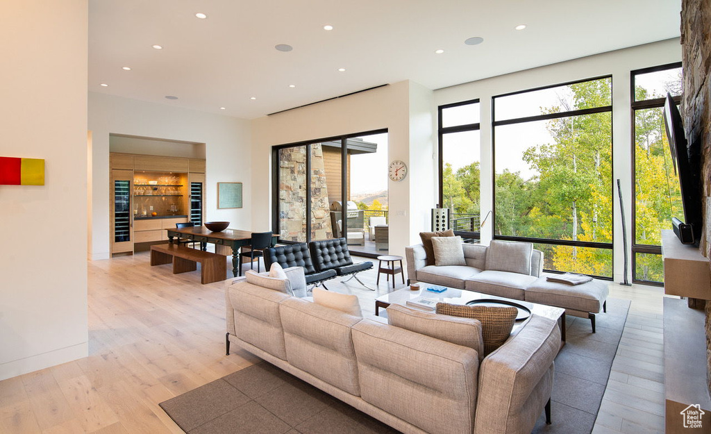 Living area featuring light wood-style floors and recessed lighting