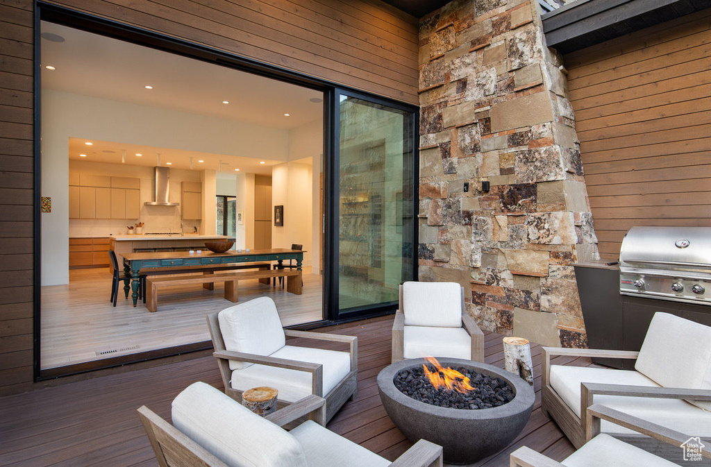 Wooden deck with an outdoor fire pit