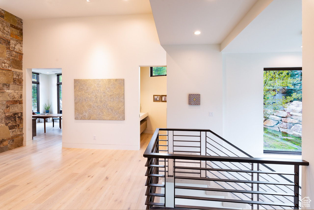 Interior space featuring a wealth of natural light, wood finished floors, and recessed lighting