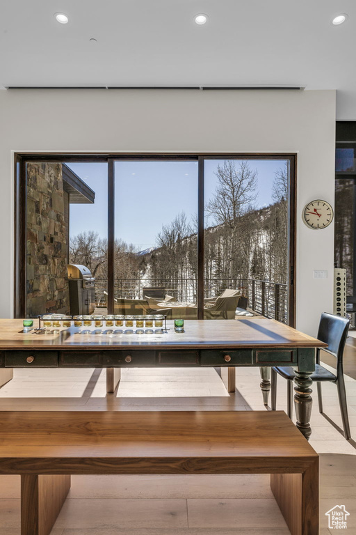 Dining area featuring recessed lighting and wood finished floors