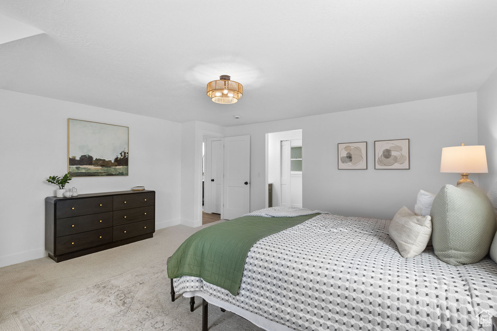 Carpeted bedroom with baseboards