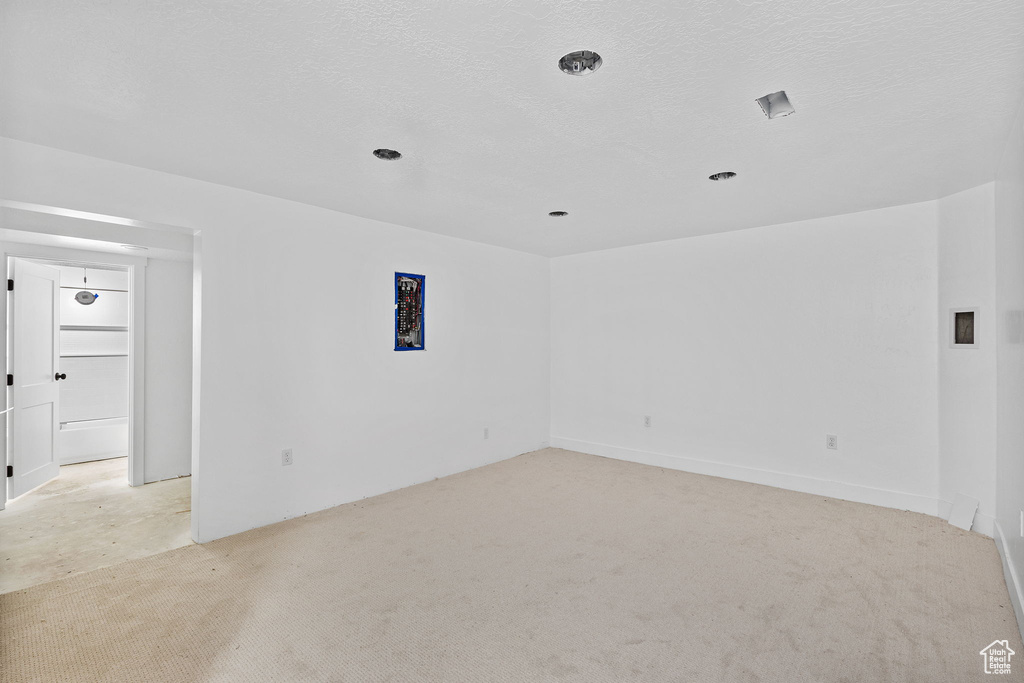 Spare room featuring light colored carpet