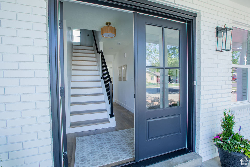 Doorway to property with brick siding