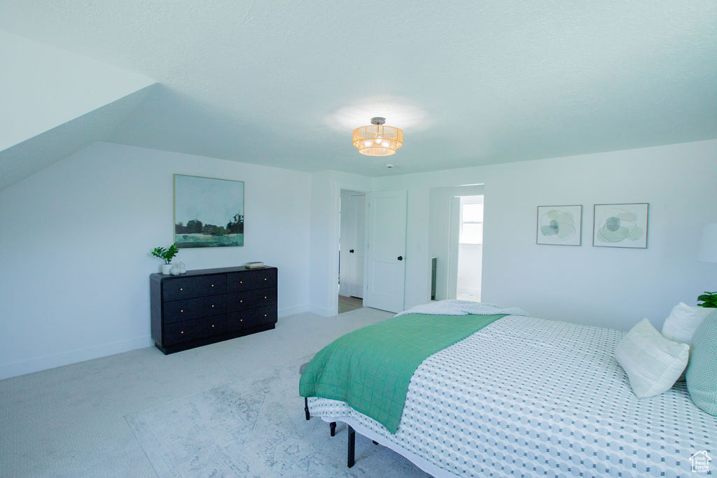 Carpeted bedroom featuring baseboards