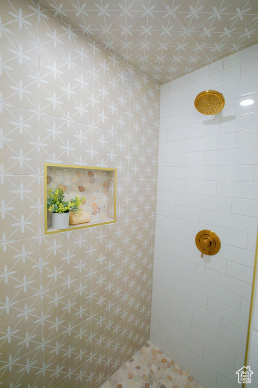 Full bathroom with a tile shower