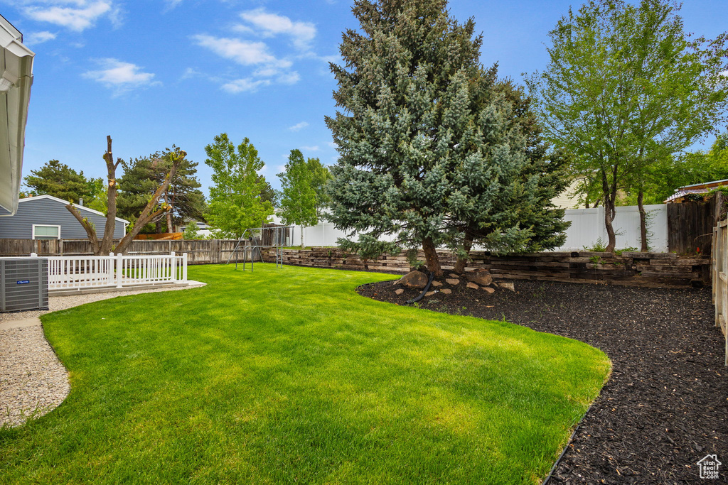View of yard with central AC