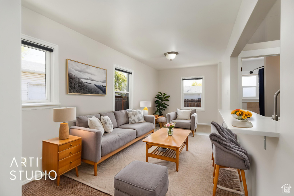 Living room featuring light carpet and baseboards