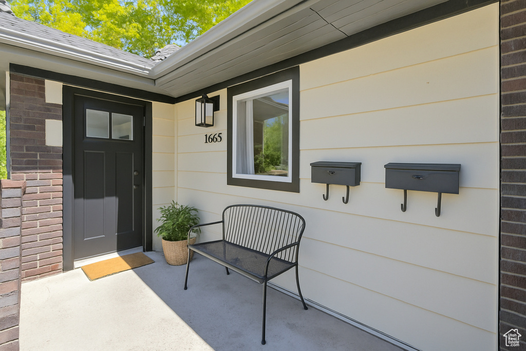 Entrance to property with brick siding