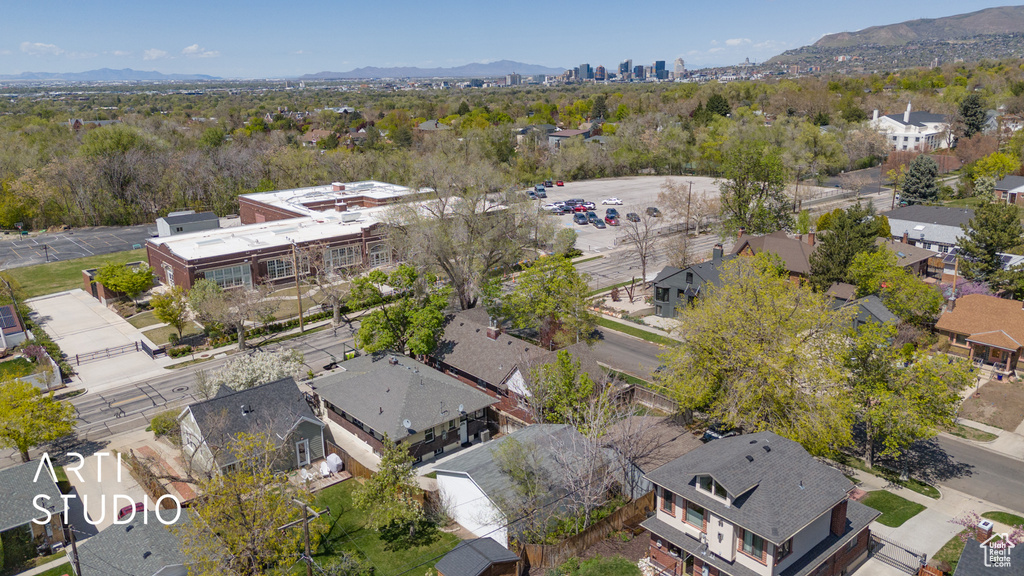 Birds eye view of property with a mountain view and a residential view