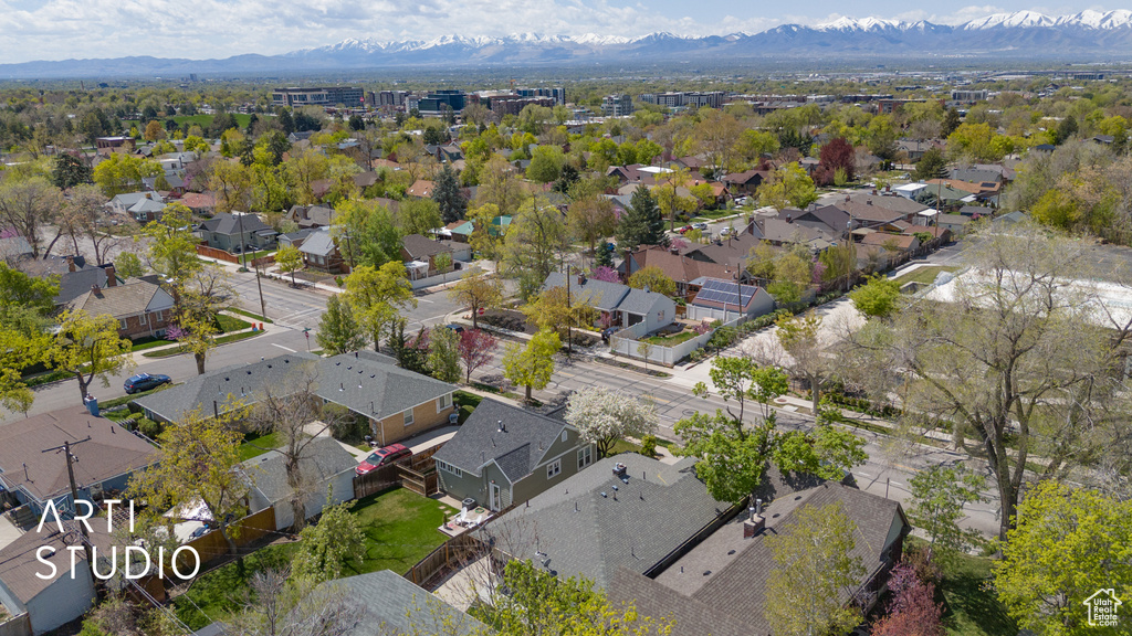 Birds eye view of property with a mountain view and a residential view