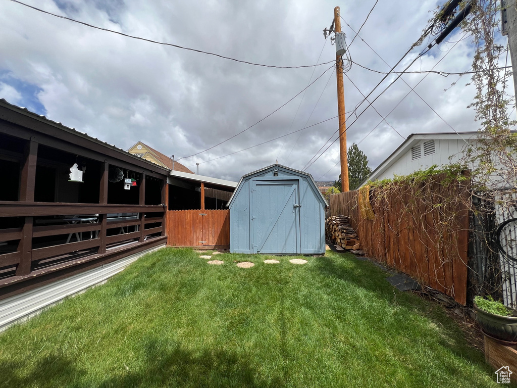 View of yard with a storage unit and an outdoor structure
