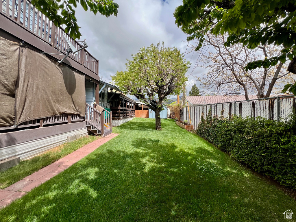 View of yard featuring fence