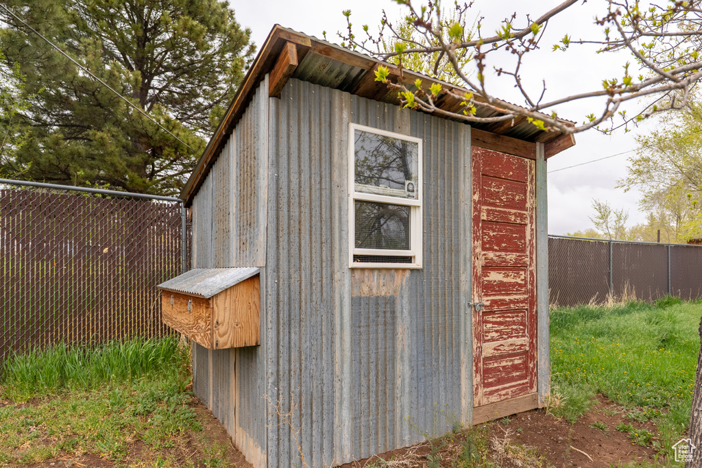 View of shed with a fenced backyard