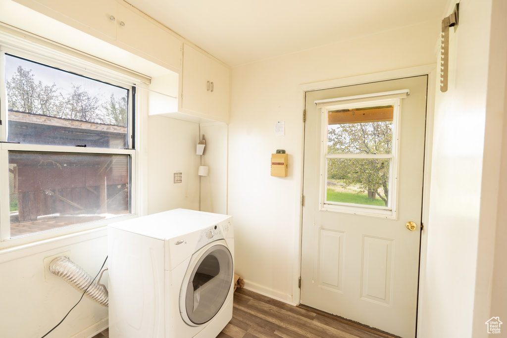 Washroom featuring washer / clothes dryer, laundry area, and dark wood-style floors