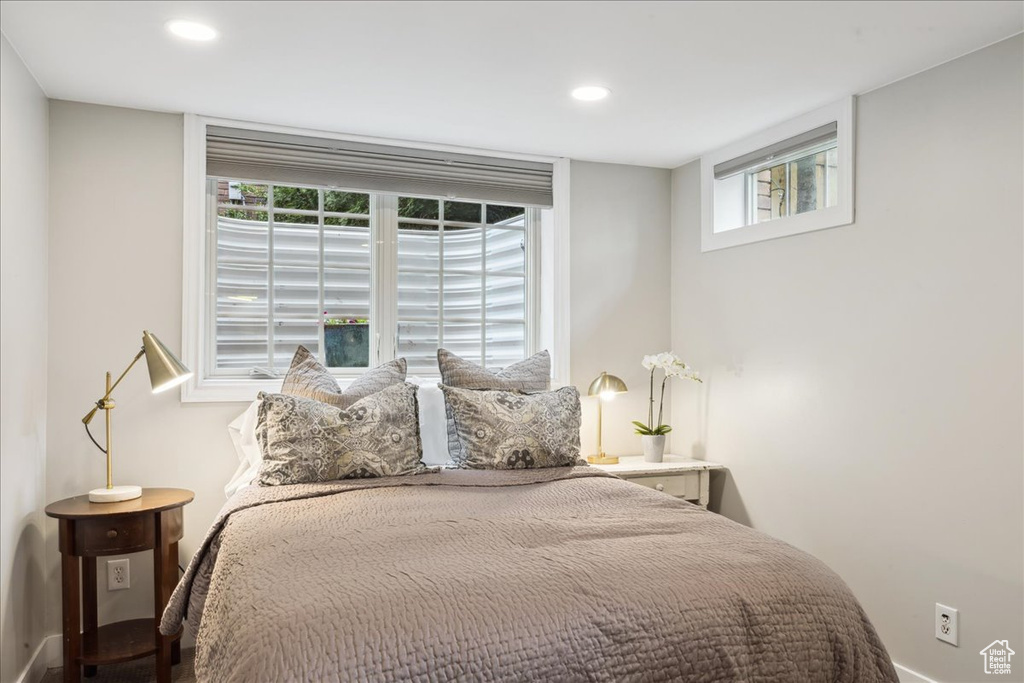 Bedroom featuring multiple windows and recessed lighting