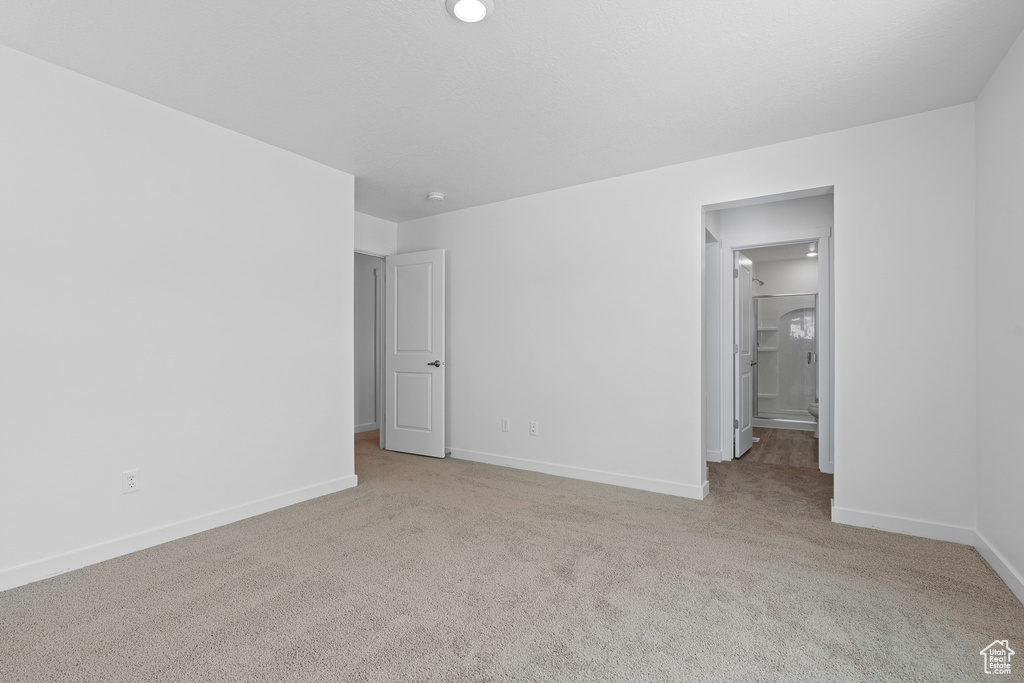 Unfurnished bedroom with baseboards and carpet floors