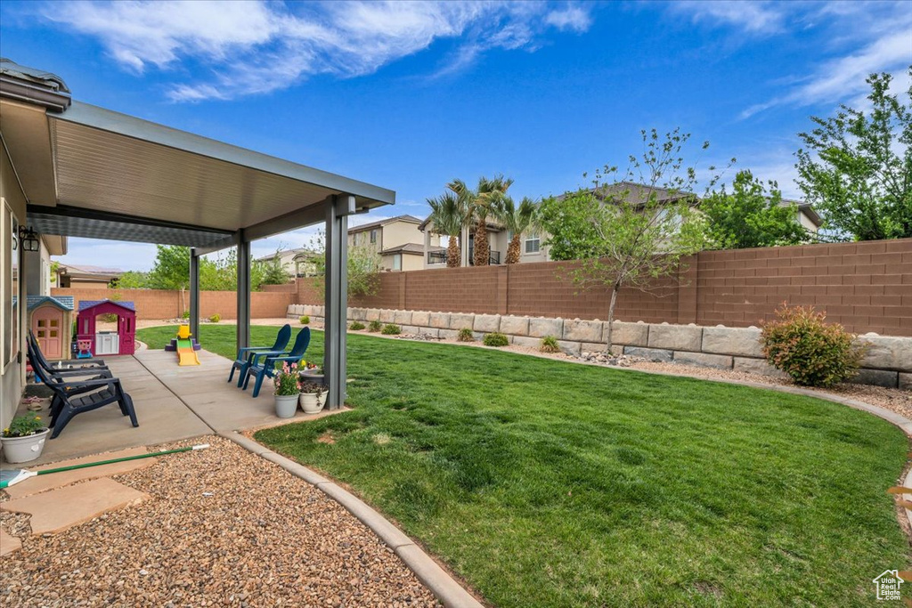 View of yard featuring a patio area and a fenced backyard
