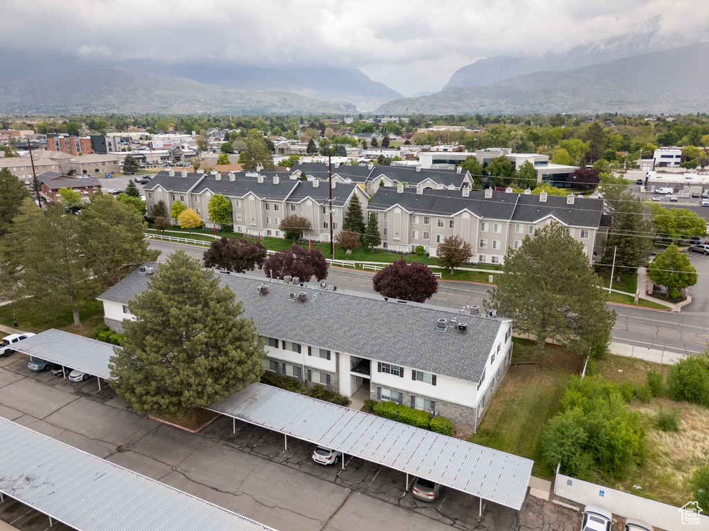 Birds eye view of property featuring a mountain view and a residential view
