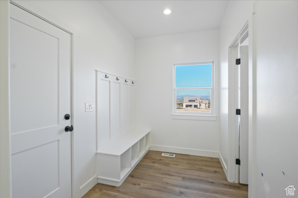 Mudroom with light wood-type flooring, visible vents, baseboards, and recessed lighting
