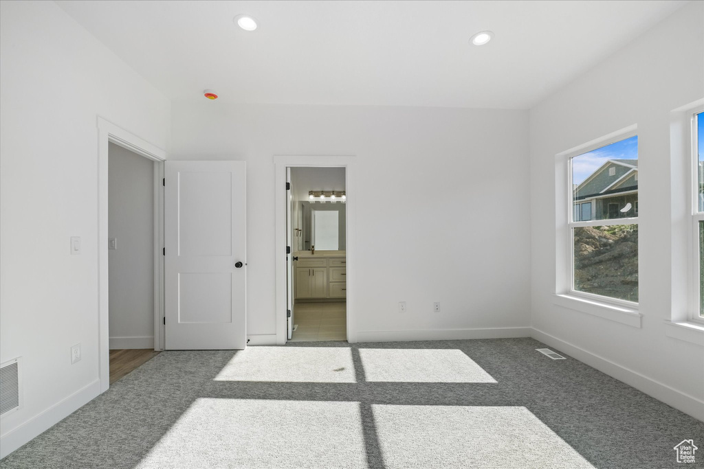 Unfurnished bedroom featuring recessed lighting, visible vents, baseboards, and carpet floors