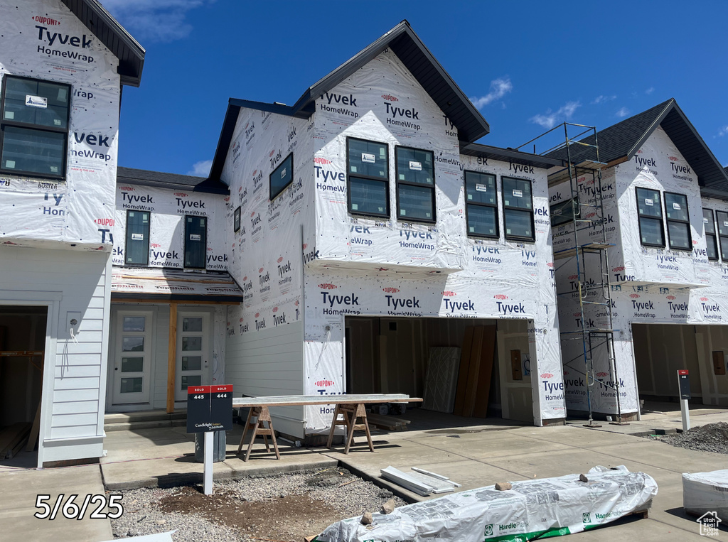 Unfinished property featuring a garage