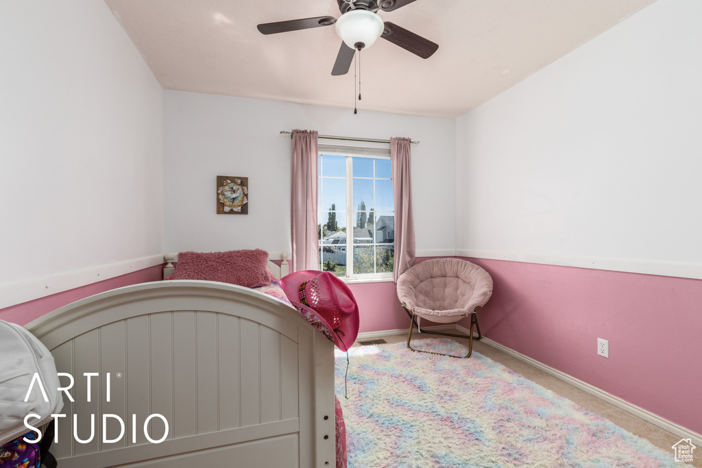 Bedroom featuring ceiling fan, carpet flooring, and baseboards