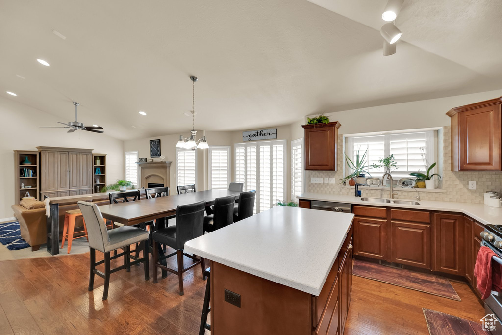 Kitchen featuring vaulted ceiling, a healthy amount of sunlight, and a sink