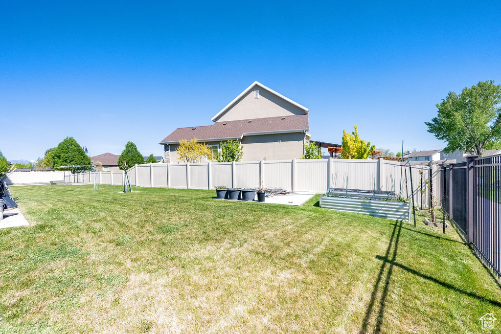 View of yard with a fenced backyard
