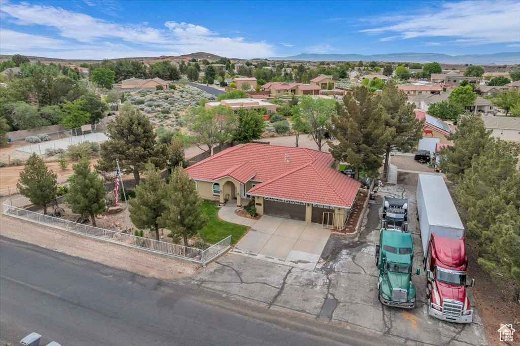 Drone / aerial view featuring a mountain view and a residential view