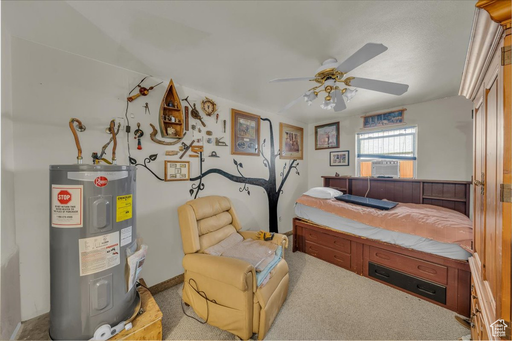 Carpeted bedroom featuring cooling unit, water heater, and a ceiling fan