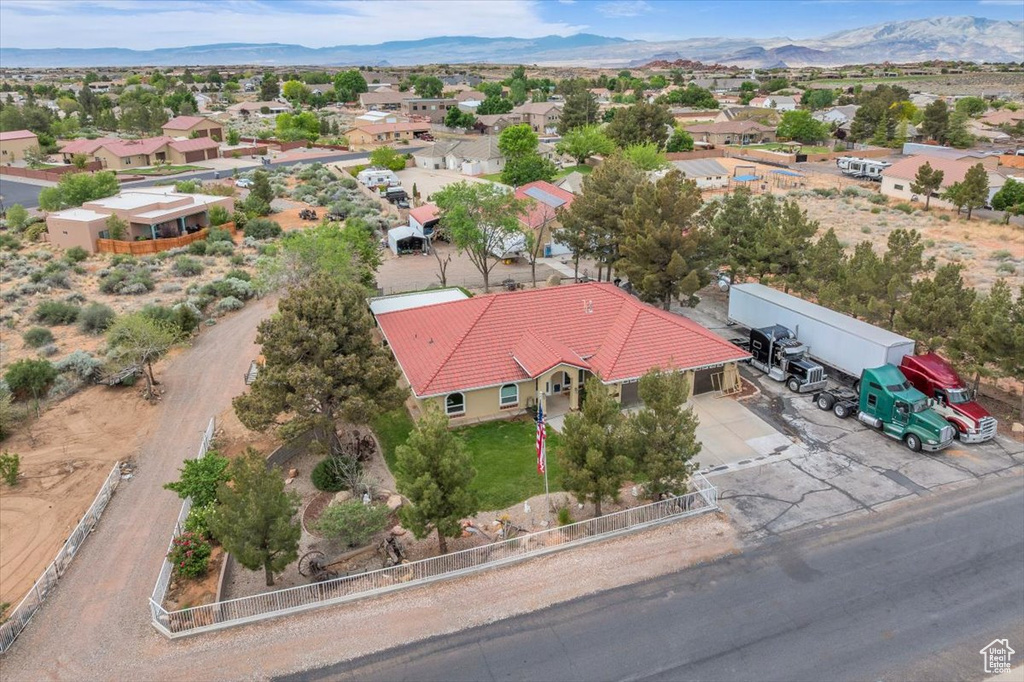 Birds eye view of property featuring a mountain view and a residential view