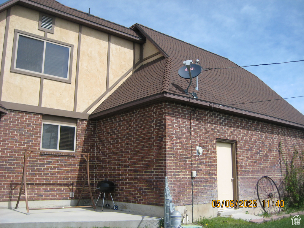 View of side of property with brick siding