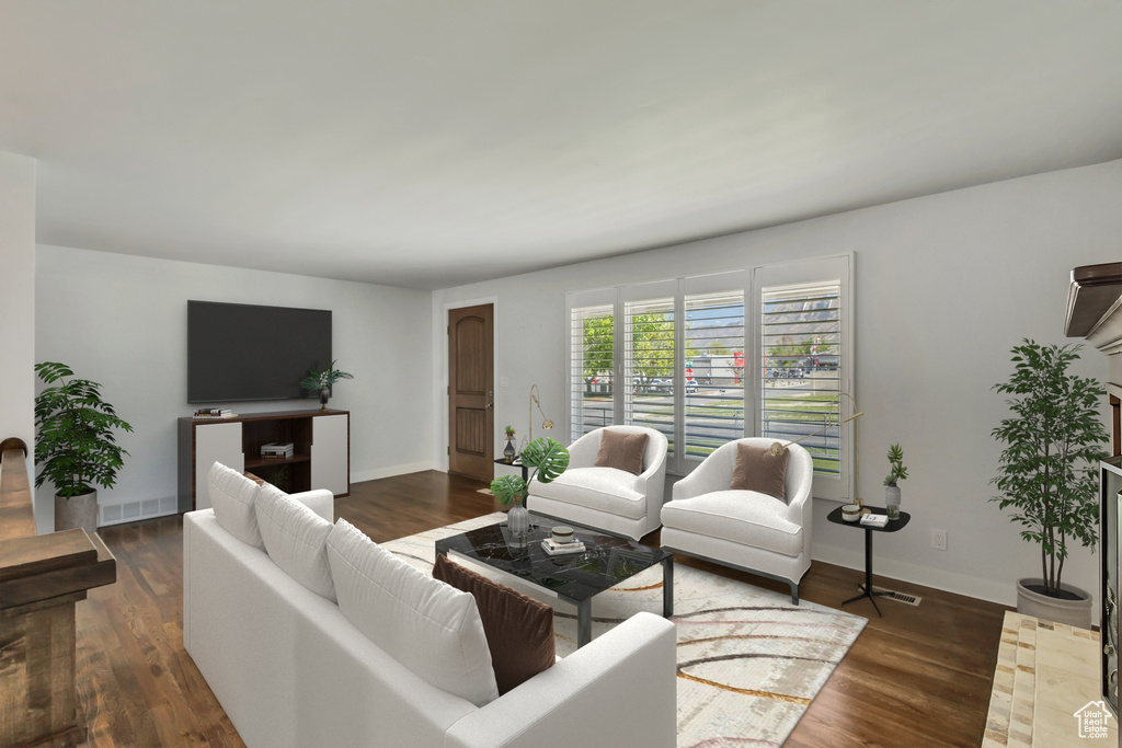 Living room featuring wood finished floors and baseboards