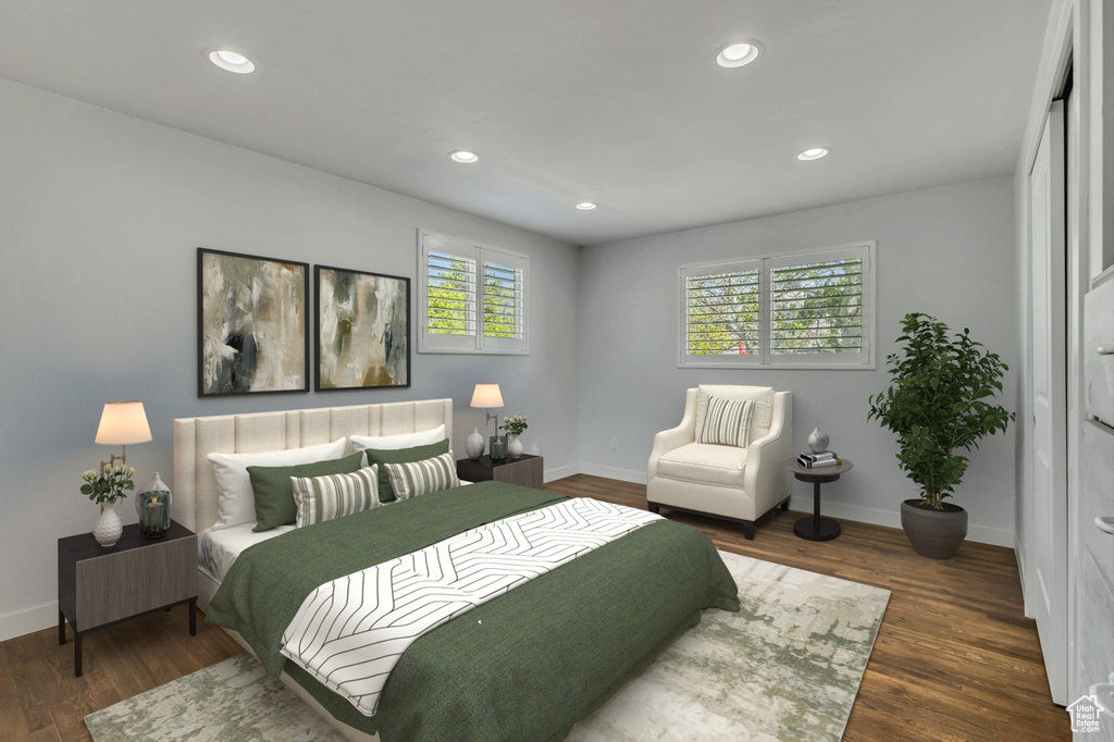 Bedroom with wood finished floors, baseboards, and recessed lighting