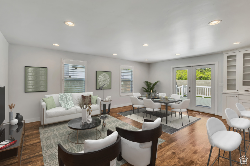 Living area with wood finished floors, baseboards, french doors, and recessed lighting