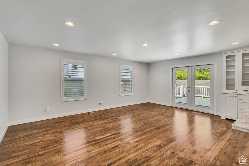 Unfurnished room featuring recessed lighting, french doors, and dark wood finished floors