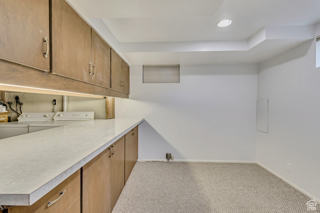 Washroom with cabinet space, independent washer and dryer, recessed lighting, carpet flooring, and baseboards