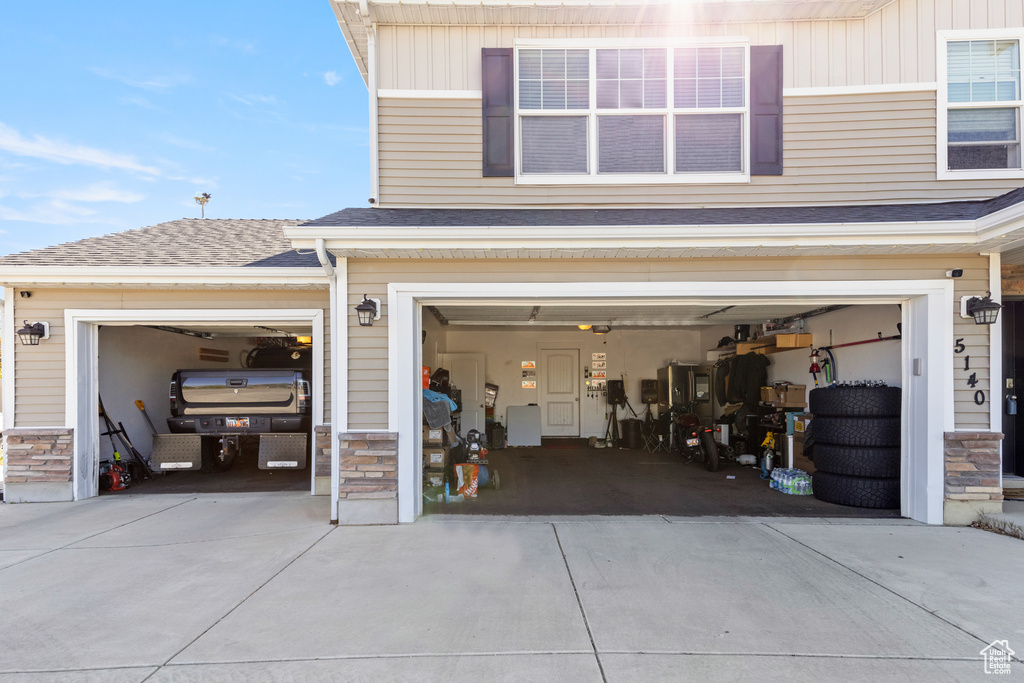 Garage with concrete driveway