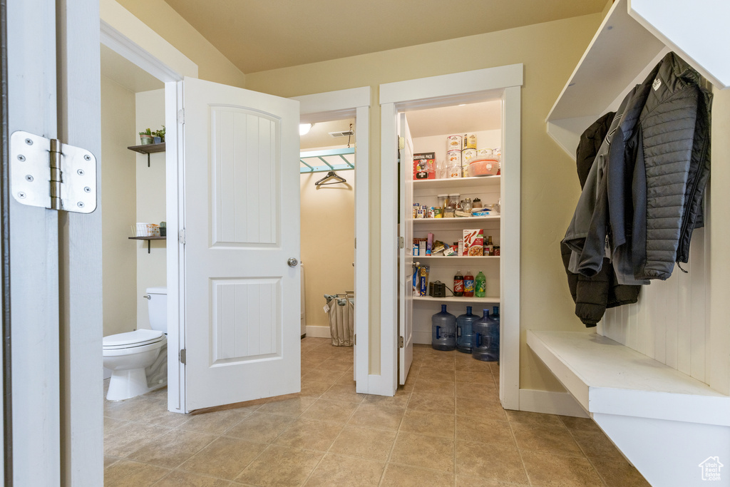 Mudroom with light tile patterned flooring