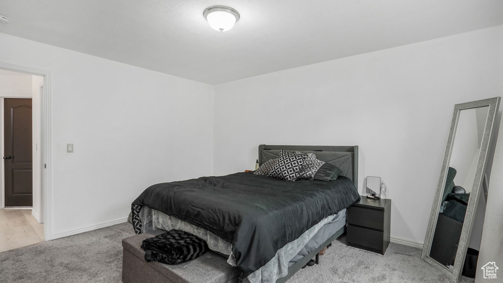 Carpeted bedroom with baseboards
