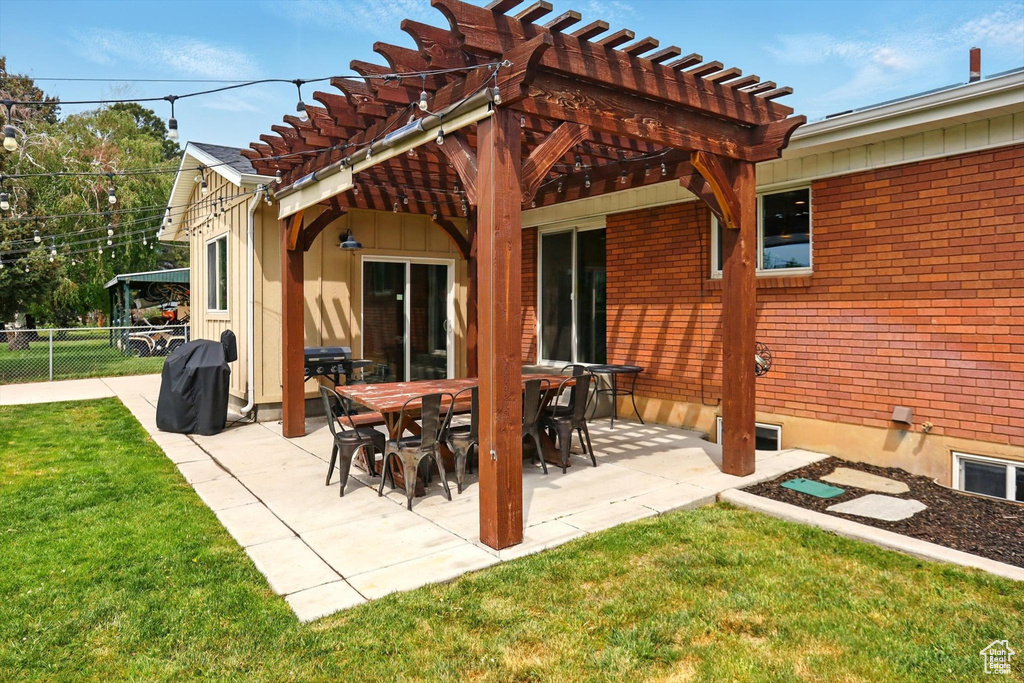 View of patio / terrace with a pergola and fence