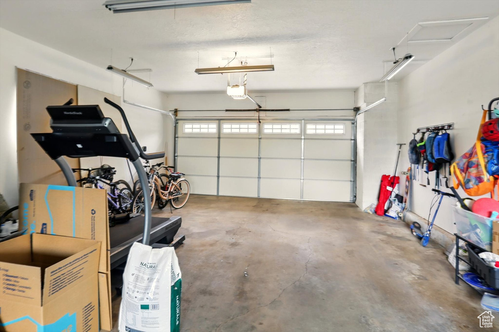 Garage featuring a garage door opener